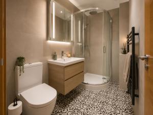 a bathroom with a shower and a toilet and a sink at Ai Stays Bentcliffe Suites in Moortown