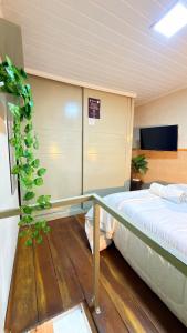 a bedroom with two beds in a room at Loft Desingn in Volta Redonda +2 photos