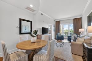 a living room with a table and chairs at Sea Gate 303 in Saint Simons Island