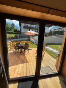 a view of a deck with a table and an umbrella at Saalach Chalet in Lofer