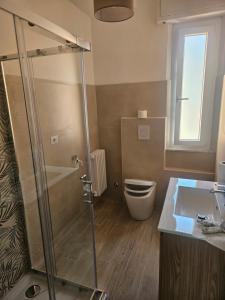 a bathroom with a shower and a toilet and a sink at palombina vista mare in Ancona