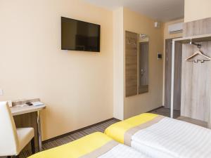 Postel nebo postele na pokoji v ubytování Raziotel Kyiv Yamska + 35 fotografií