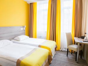 Postel nebo postele na pokoji v ubytování Raziotel Kyiv Yamska