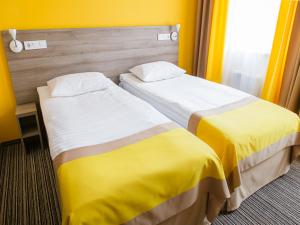 Postel nebo postele na pokoji v ubytování Raziotel Kyiv Yamska