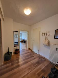 an empty living room with a hard wood floor at Studio in Fürstenfeld