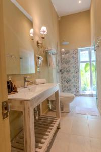 a bathroom with a sink and a toilet at Cabrero House Boutique in Cartagena de Indias