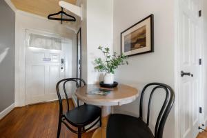 a small table and chairs in a room at Historic Riverview Inn Two in Chattanooga