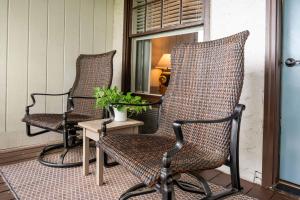 two chairs and a table on a porch at Historic Riverview Inn Two in Chattanooga +26 photos