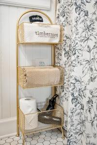 a bathroom with a gold shelf with toiletries at Historic Riverview Inn Four in Chattanooga +21 photos