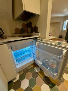 an open refrigerator in the middle of a kitchen at Casa Picicio in Assisi +41 photos