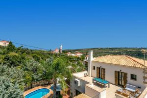 an image of a villa with a swimming pool at Villa Areti by Villa Plus in Spiliá