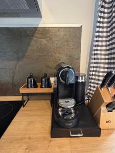 a blender sitting on top of a wooden table at Apartment Landglück Overath in Overath +6 photos