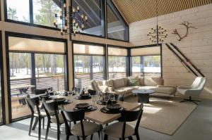 a dining room with a table and chairs at Villa Liemu, Winter season included 2 lift tickets in Äkäslompolo