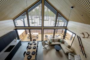 an overhead view of a living room with large windows at Villa Liemu, Winter season included 2 lift tickets in Äkäslompolo