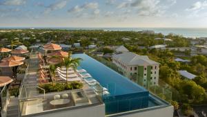 an aerial view of a resort with a swimming pool at ONE GT Grand Cayman in George Town