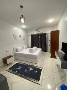 a bedroom with a bed and a rug in a room at pure peace hotel in Luxor +55 photos
