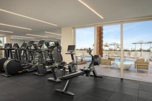 a gym with treadmills and cardio equipment in a hotel at ONE GT Grand Cayman in George Town