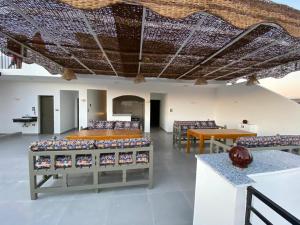 a large room with chairs and a table and a ceiling with at pure peace hotel in Luxor