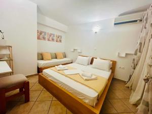 a small room with a bed and a couch at Alexandra's House in Skiathos