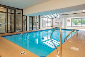 a swimming pool in a building with windows at Oak Square Rentals in Gatlinburg