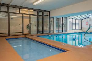 an indoor swimming pool with a large swimming pool at Oak Square Rentals in Gatlinburg +1 photo