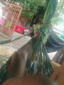 a person sitting in a hammock with their feet up at Sihanuk in Sihanoukville