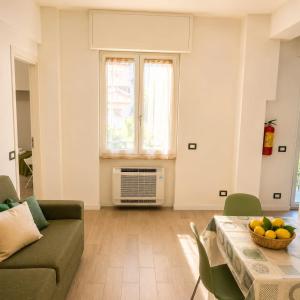 a living room with a couch and a table at Bolle Apartment Monterosso al mare in Monterosso al Mare