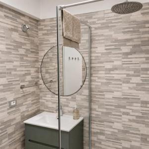 a bathroom with a sink and a shower at Bolle Apartment Monterosso al mare in Monterosso al Mare +6 photos