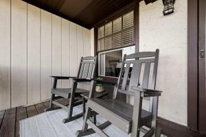 two chairs sitting on the porch of a house at Historic Riverview Inn Six in Chattanooga