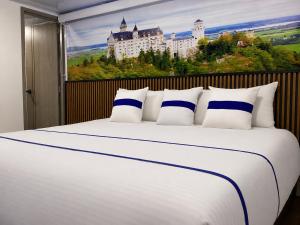 a bedroom with a large bed with a large castle at Paramount Hotel in Bogotá