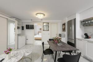 a kitchen and dining room with a table and chairs at Villa Andriana in Panagia +16 photos