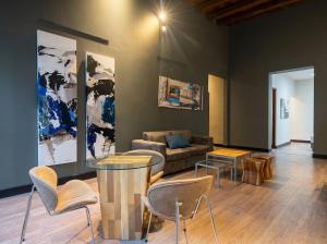 a living room with a couch and a table and chairs at Posada del Blanco in Potrerillos