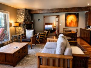 a living room with a couch and a table at Emerald Lake Lodge in Field