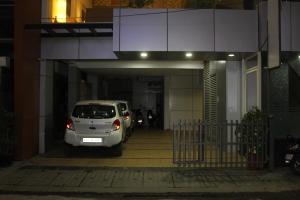 a white van parked in a parking lot at The Lotus Boutique Hotel in Chikmagalūr