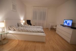 Llit o llits en una habitació de Modern Apartment at Rathaus