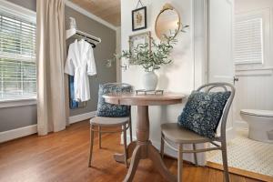 a dining room with a table and two chairs at Historic Riverview Inn Eight in Chattanooga