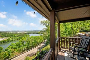 a porch with two chairs and a view of a river at Historic Riverview Inn Eight in Chattanooga +27 photos
