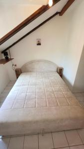 a large bed in a room with at Safari Luštica in Luštica