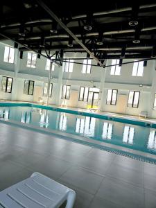 a swimming pool with a bench in the middle of it at Welcome3 in Achʼqva +9 photos