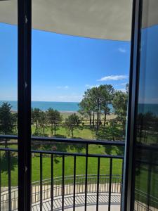 a view of the ocean from a balcony at Welcome3 in Achʼqva