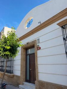 a building with a scientology sign on it at Apartamentos Lebrero in San Fernando