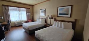 a hotel room with two beds and a window at Canal Park Lodge in Duluth +31 photos