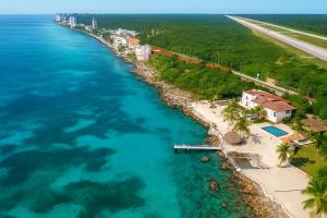 an aerial view of a beach and the ocean at Villa Bonita Torre 11 3 in Cozumel