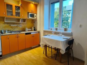 a kitchen with a table with two wine glasses on it at Solaris in Ostrava