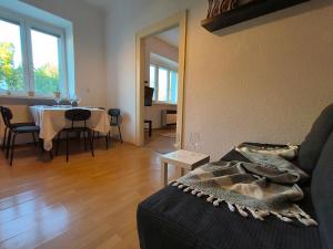 a living room with a table and a dining room at Solaris in Ostrava