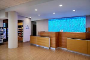 a lobby of a store with a large screen at Fairfield Inn & Suites by Marriott Stafford Quantico in Stafford +16 photos