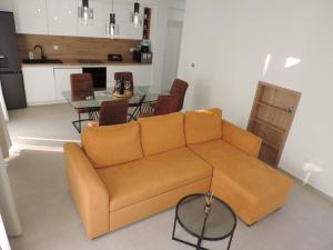a living room with a couch and a table at Villa RoseMary in Split