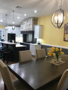 a kitchen and dining room with a table and chairs at Matt Cozy Quarters in Orangeburg