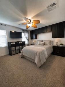 a bedroom with a bed and a ceiling fan at Matt Cozy Quarters in Orangeburg