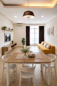 a living room with a table and a couch at Damansara#IOI Mall Damansara #Sunway Nexis#Golf course Sunset view in Petaling Jaya